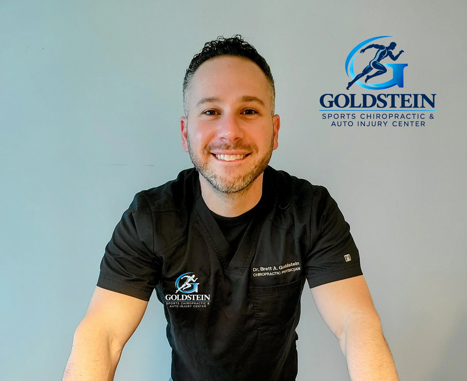 Dr. Brett Goldstein, D.C., in his chiropractic work attire.
